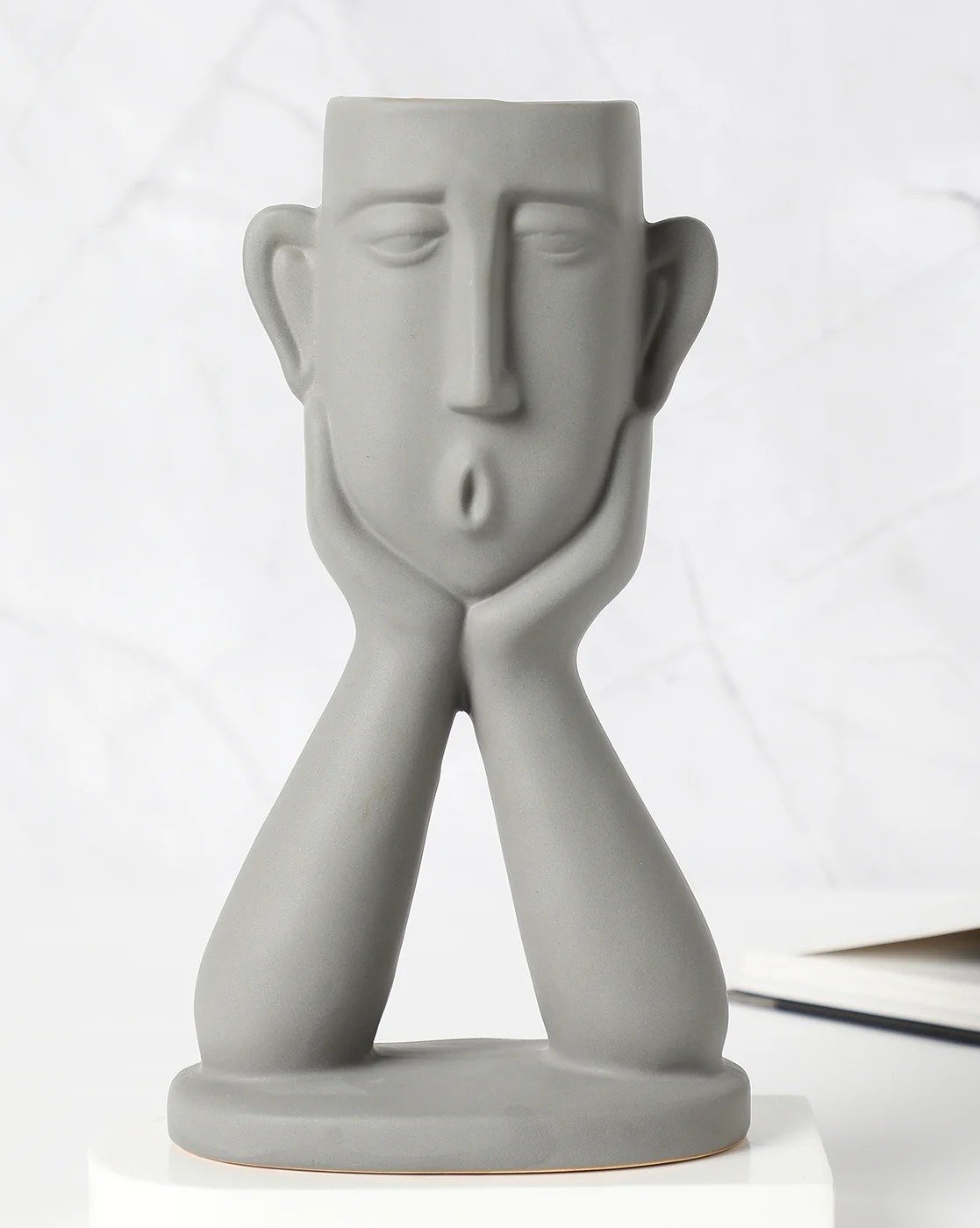 Matte ceramic surface, neutral glaze.