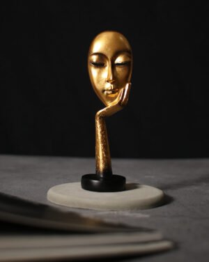 Gold Face Resting On Hand Ceramic Figurine