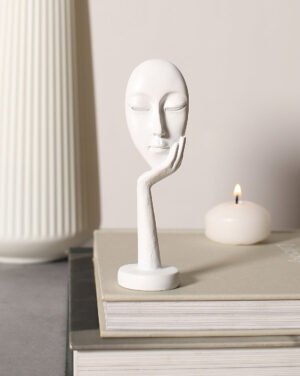 White Face Resting On Hand Ceramic Figurine